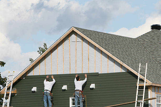 Professional Siding Repair technician working in North Reading, MA